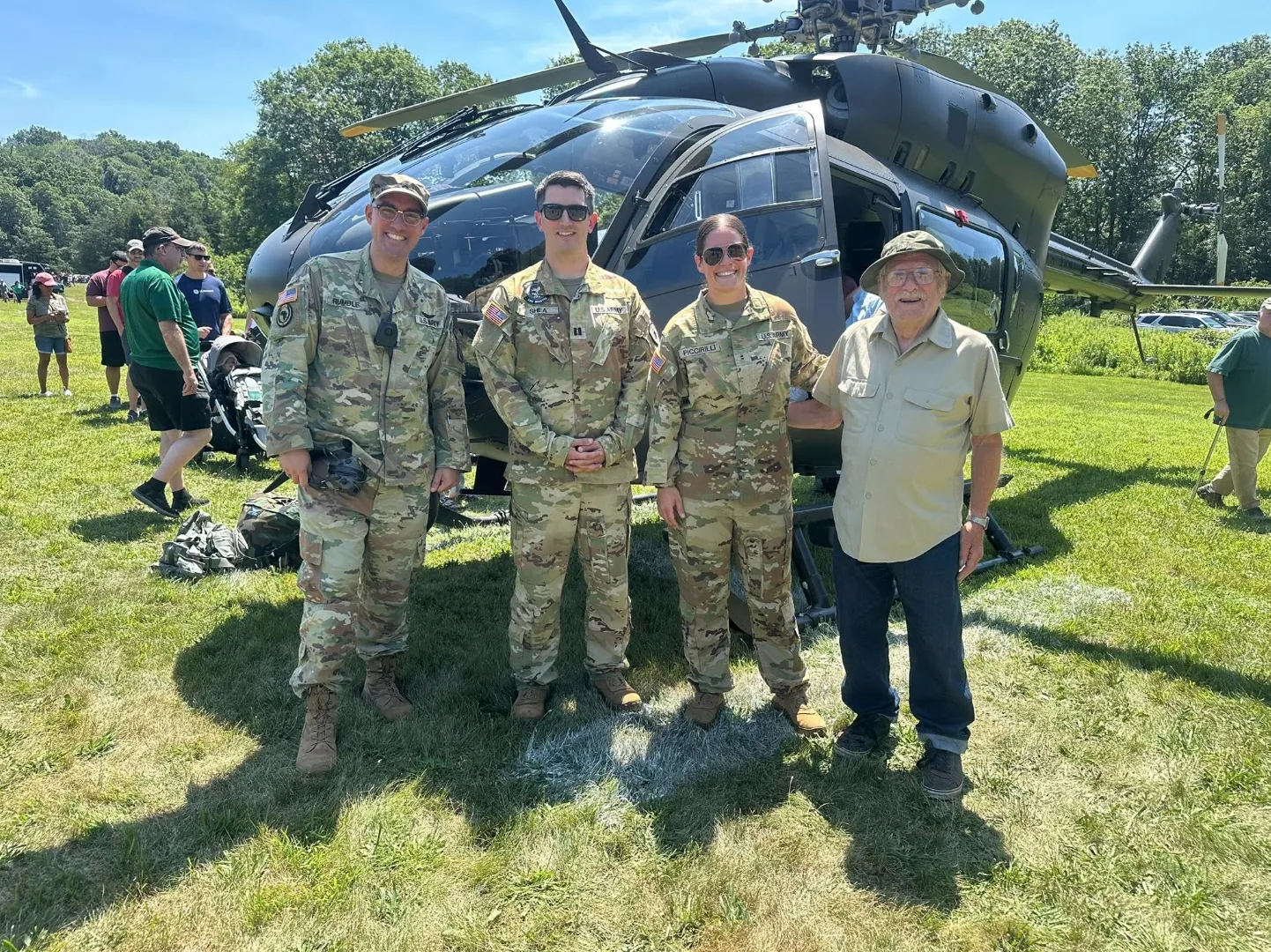 Army aviation crew beside a helicopter