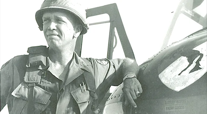 Major General George S. Patton IV beside a helicopter