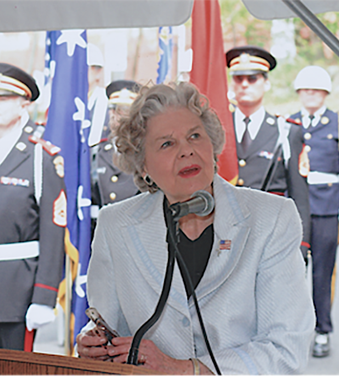 Joanne Holbrook Patton speaking at a podium